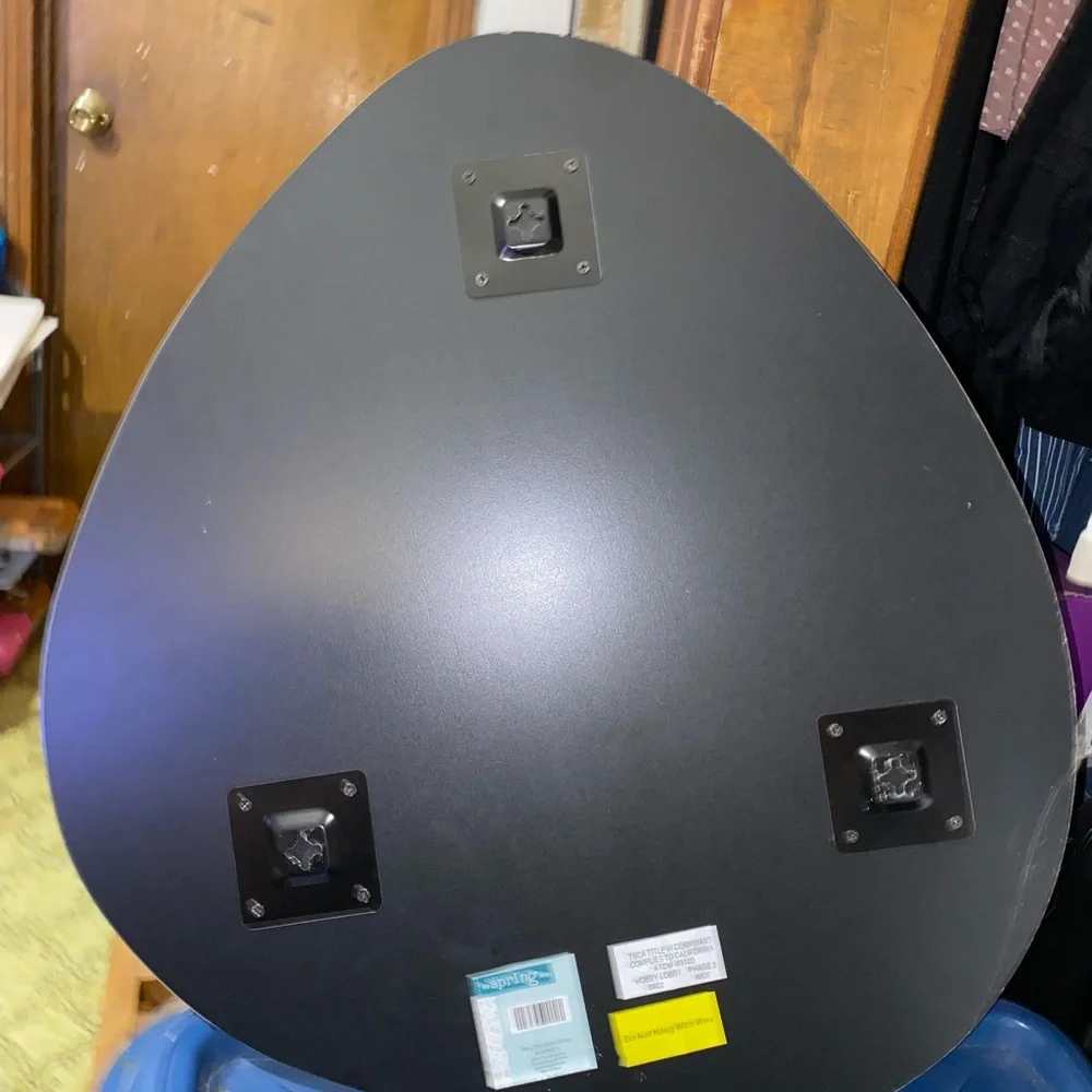 Mirror that is odd shaped. It says 20x22 for sizing